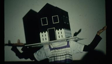 n image of a house with arms from filmmaker Linda Nishio